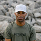 Outsider White on White Monochrome Hat with adjustable snapback modeled on a man